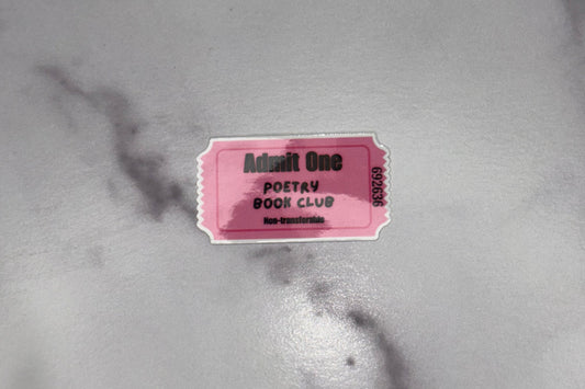 Pink ticket with text on a marble surface