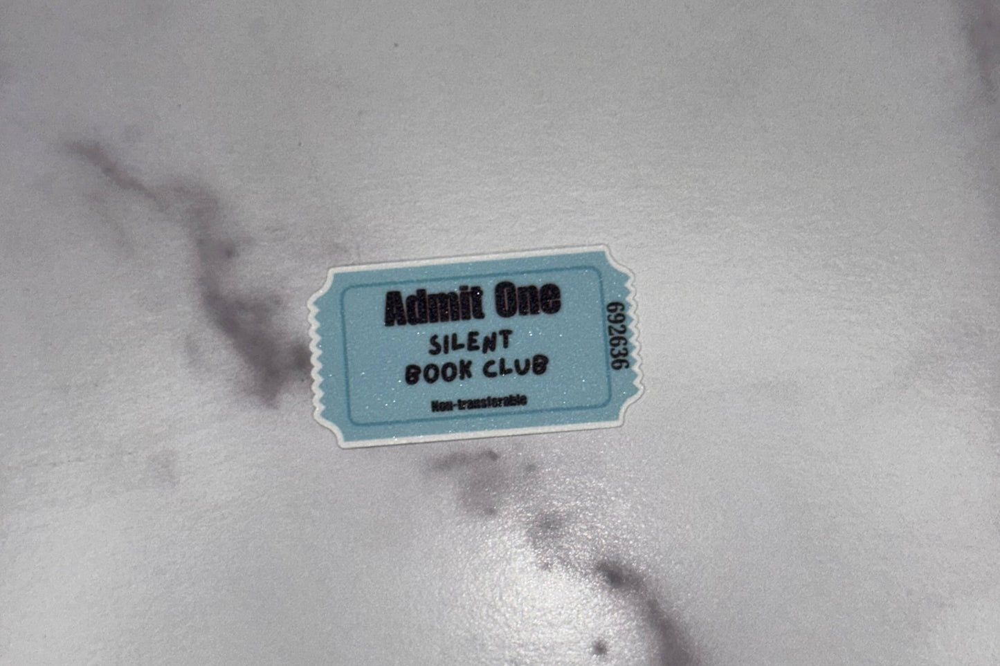 Small rectangular tag on a marble surface